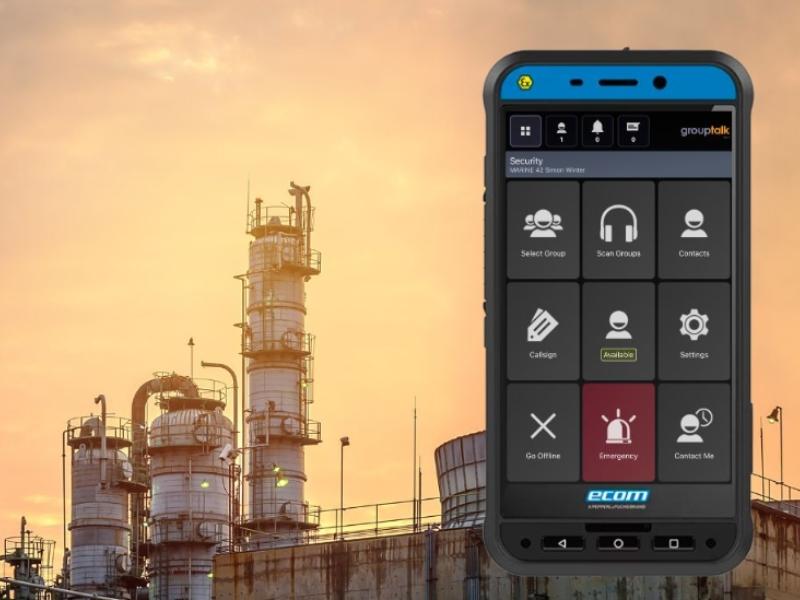 ATEX Smart EX02 smartphone for explosive hazardous work environments. Picture of a factory