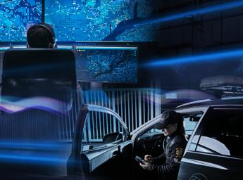 Security staff sitting in a car using a smartphone.