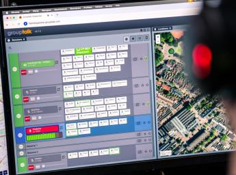 Control room dispatcher managing team via GroupTalk