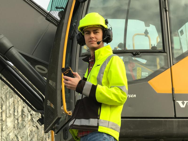 Construction workers with Push to Talk two way radio and earmuffs with push to talk