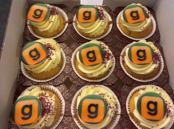 Picture of nine cupcakes with the grouptalk icon