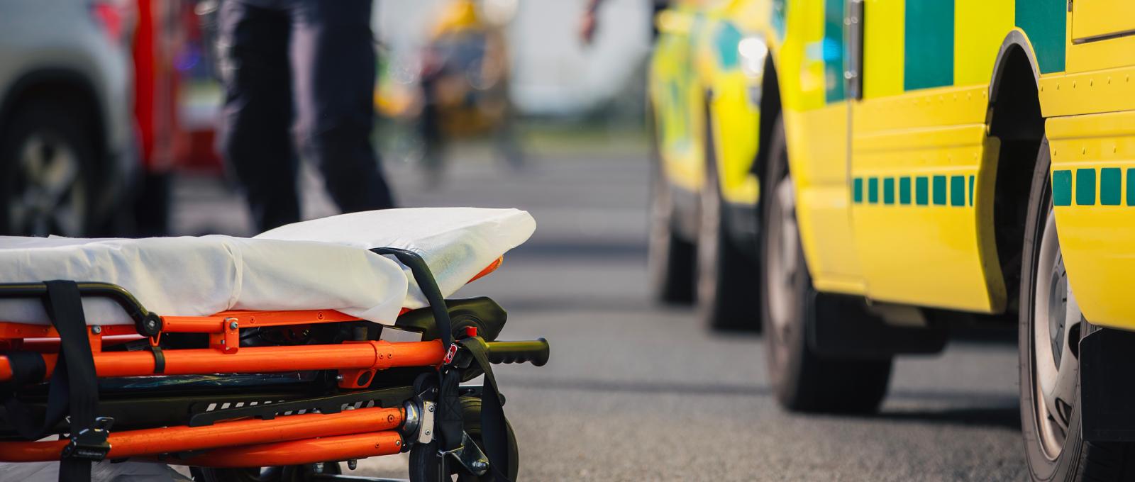 Ambulance with stretcher lying on the ground