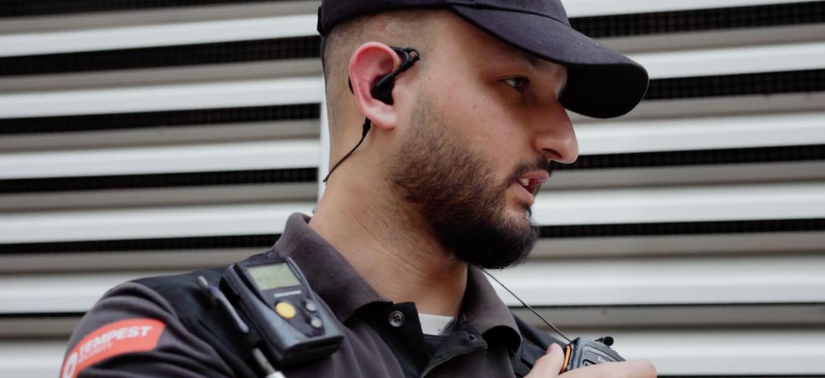 Security guard using rsm and wired headset for push to talk communication