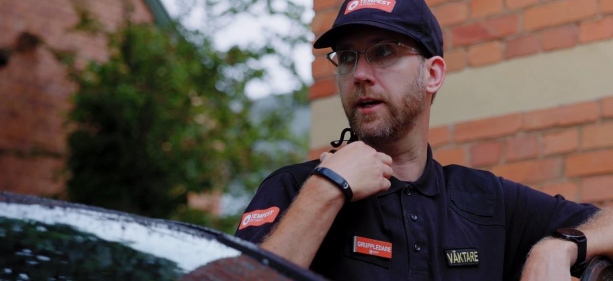 Tempest security guard using push to talk headset and walkie talkie app on smartphone.