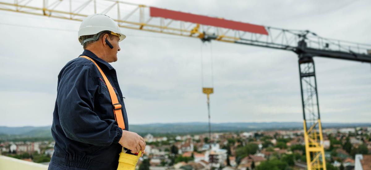 Crane operator using GroupTalk for full-duplex communication.