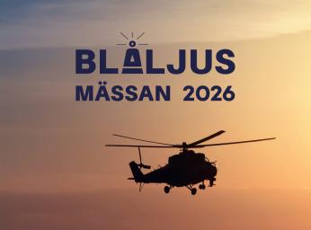 Helicopter in the air during sunset.