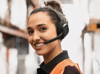 Women using a Jabra perform 75 push to talk headset.