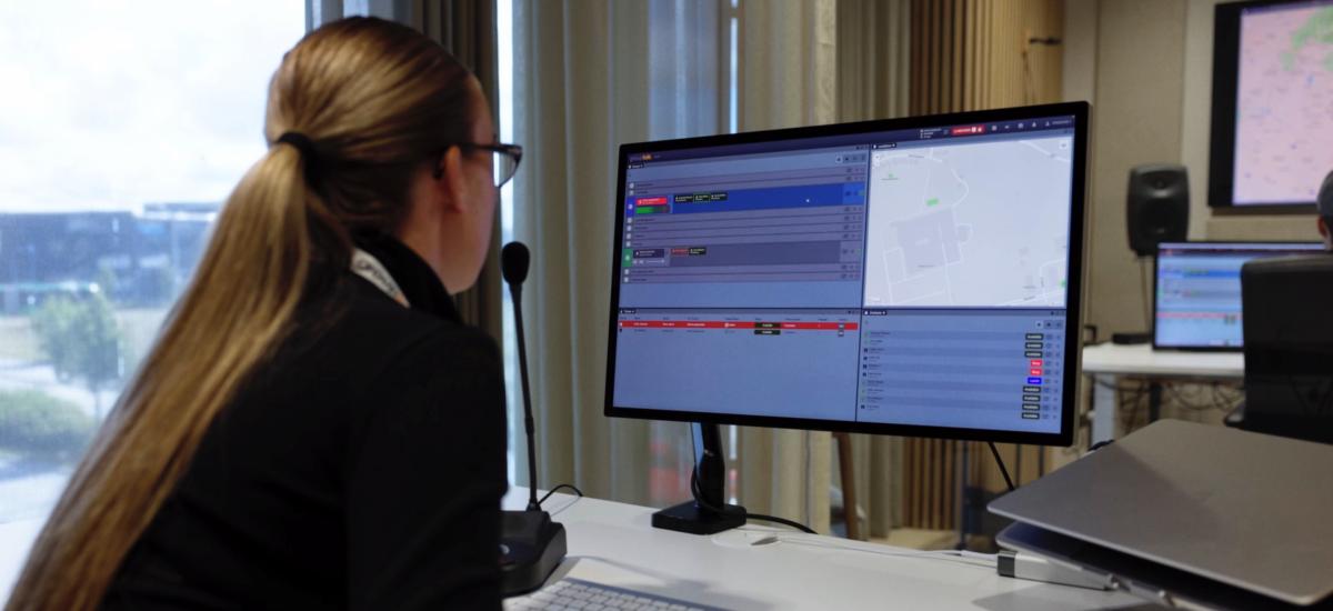 Women working as a dispatcher at an command and control center