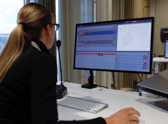 Women working as a dispatcher at an command and control center