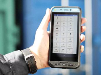 Man holding a Ecom Smart-Ex02 smartphone for ATEX use