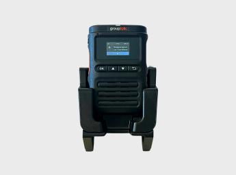 GT15 push-to-talk over cellular radio and a desktop charger from GroupTalk.