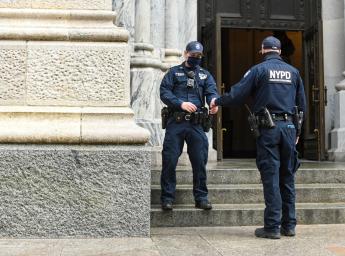Two personnel working at entrance gate.