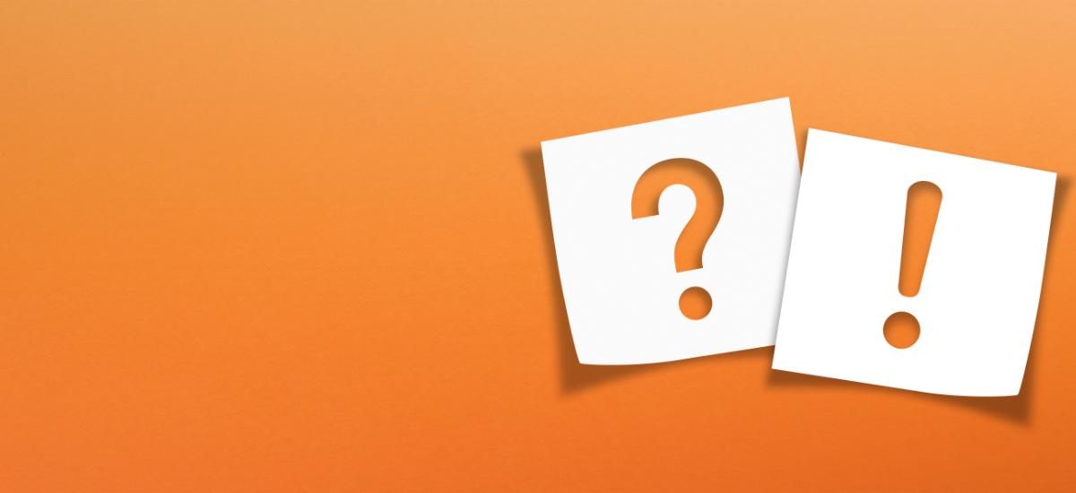 Note paper with exclamation mark and question mark on orange background.