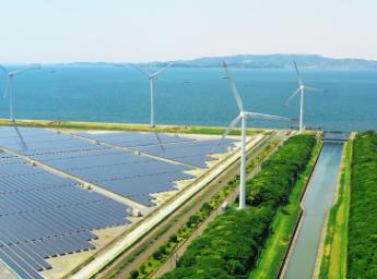 Renewable energy site with solar panels and windmills from above.