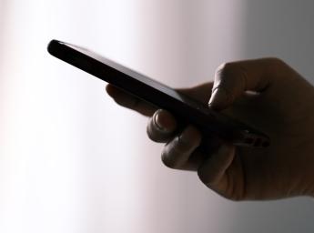 Mobile device sending text messages in walkie talkie app.