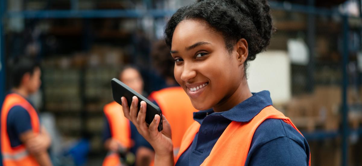 Logistic worker using iphone as walkie talkie