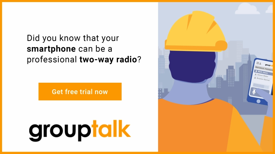 Construction worker holding a smartphone with the Grouptalk app